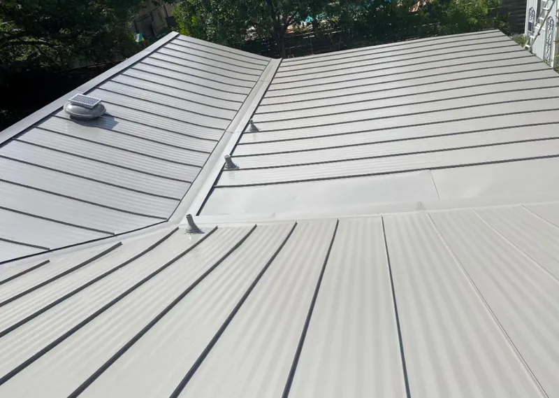 Solar attic fan installed on a metal roof for Roof Ventilation in Sylacauga